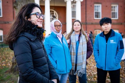 Dean Bárbara Brizuela talks with graduate students Zainab Mohamed, Daniela-Filipa Soltan, and Qimei (May) Liu at Fall Fest on November 16, 2021.