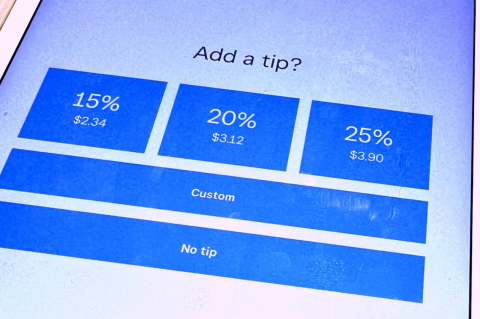 A smartphone screen asking &quot;Add a tip?&quot;