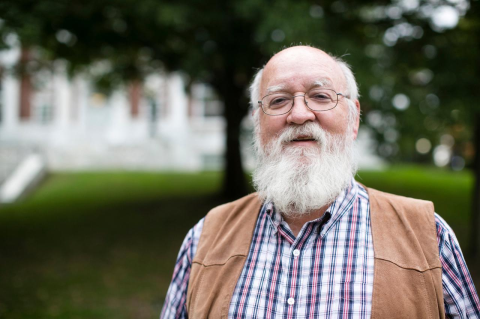 Daniel Dennett standing outside Tisch Library at Tufts University. An appreciation of the Tufts philosopher, who died in April 2024
