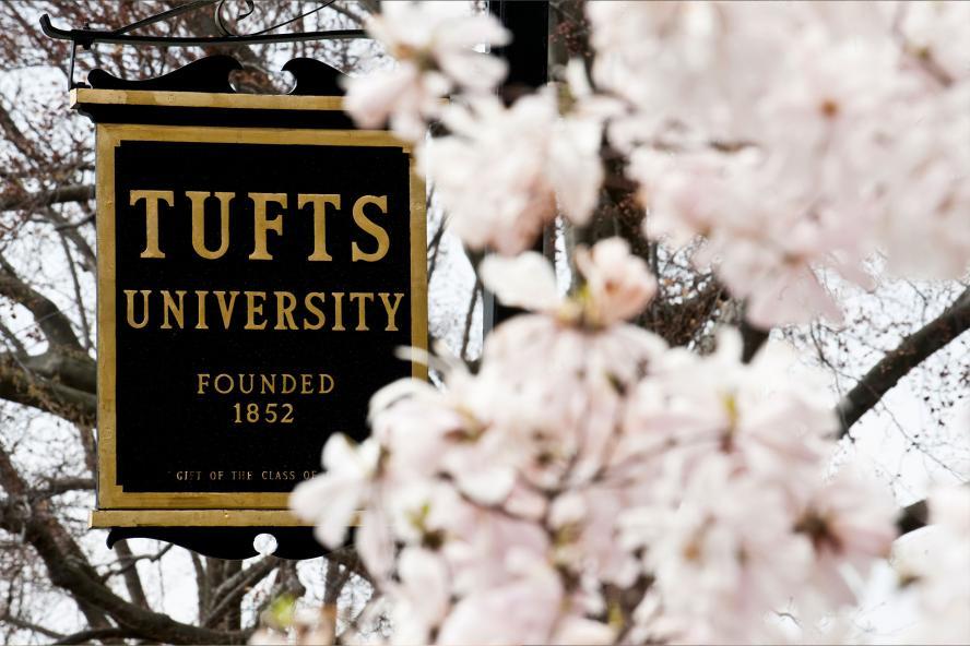 Tufts sign against white flowers