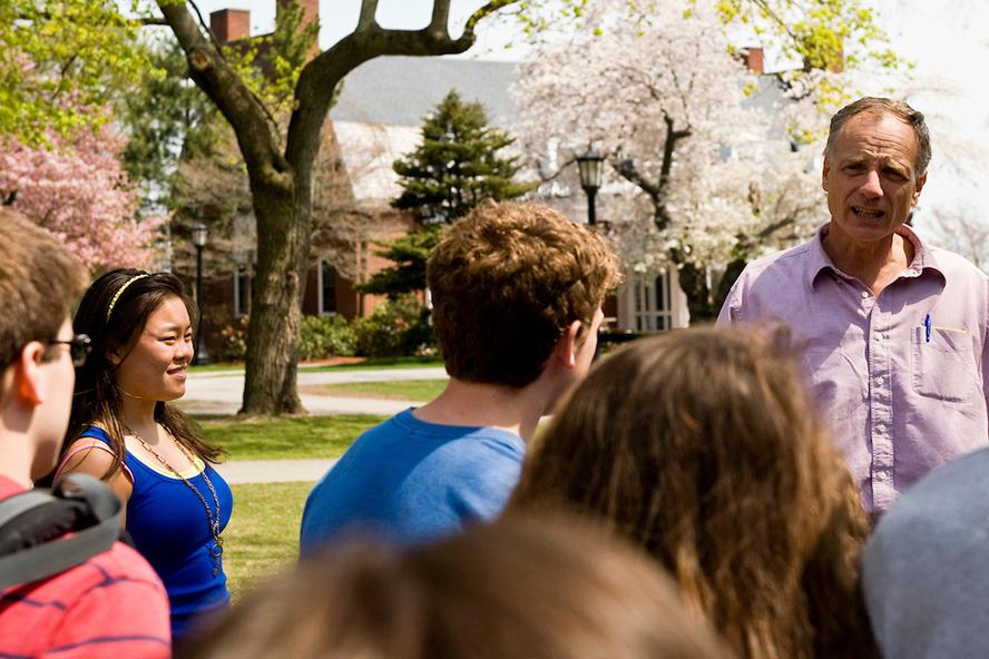 Tufts University Professor of Biology George Ellmore leads undergraduate students on a nature walk uphill on the Medford Campus