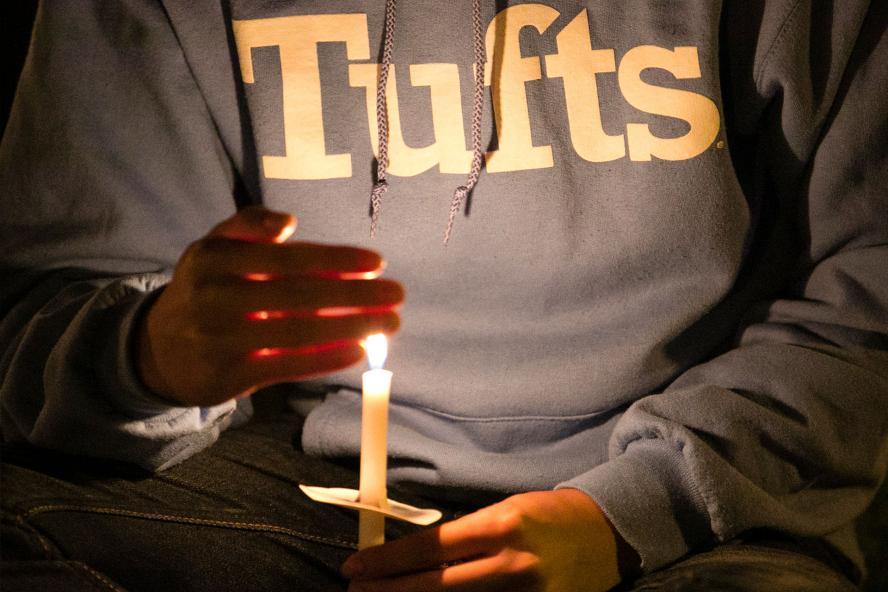 student holding a candle