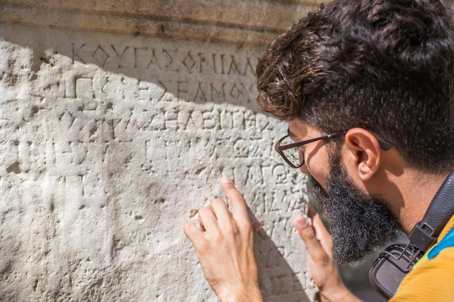 student studying greek letters
