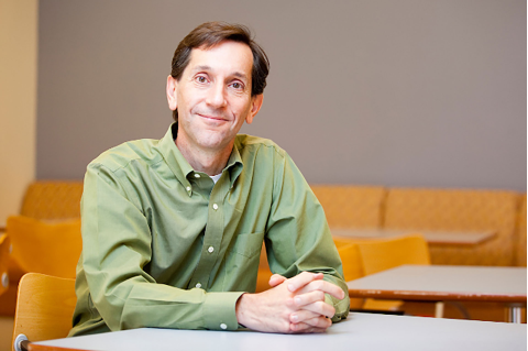 William Masters sitting at a table. Masters was recently selected as one of five new fellows of the Agricultural & Applied Economics Association (AAEA) for 2020.