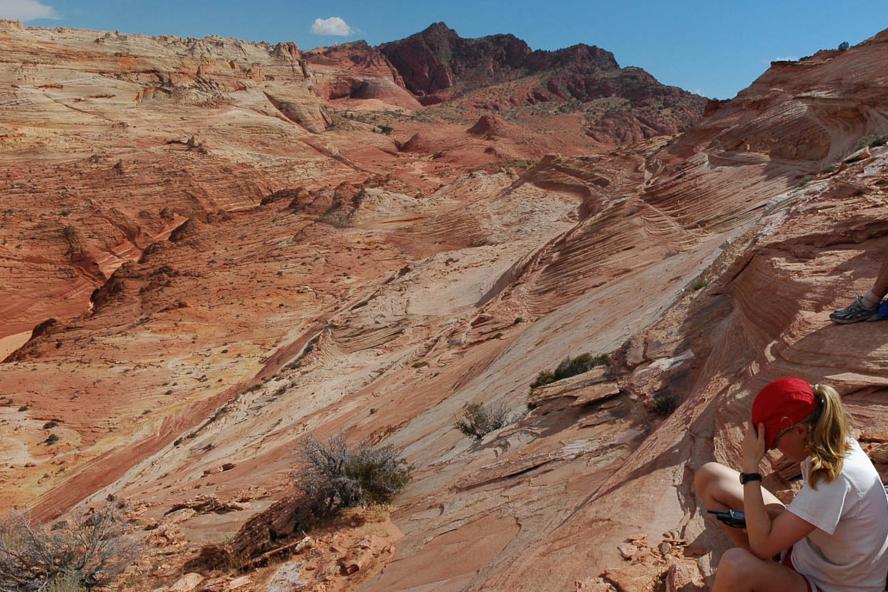 Student sitting in rock formations