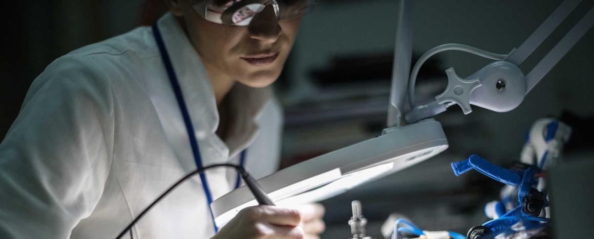Electrician working on a circuit board