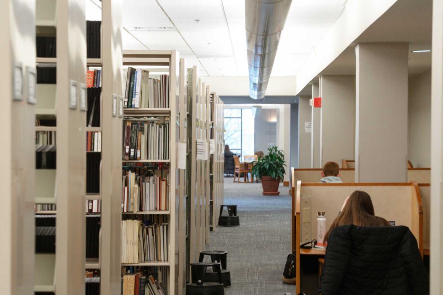 Students working at cubicle desks in Tisch Library