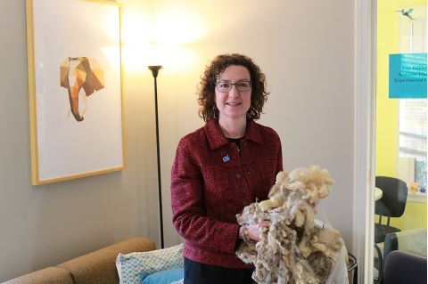 Amy Goldstein poses with her sheep fur 