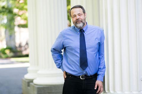 Robert Cook leaning against a column
