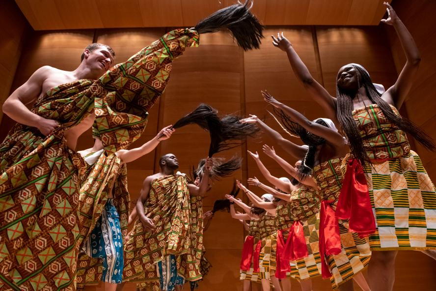 Students dance as part of a performance by Kiniwe, the African Drum and Dance Ensemble of the Tufts Music Department.