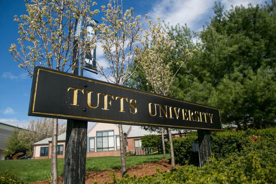 Tufts University sign with flowers in forefront