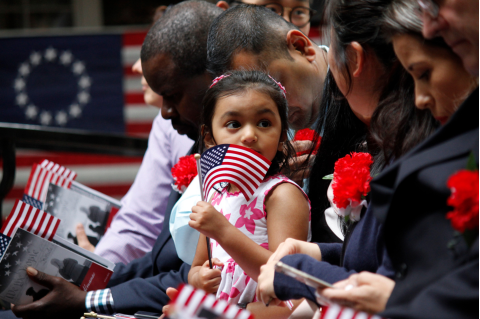 Child holding the American Flag