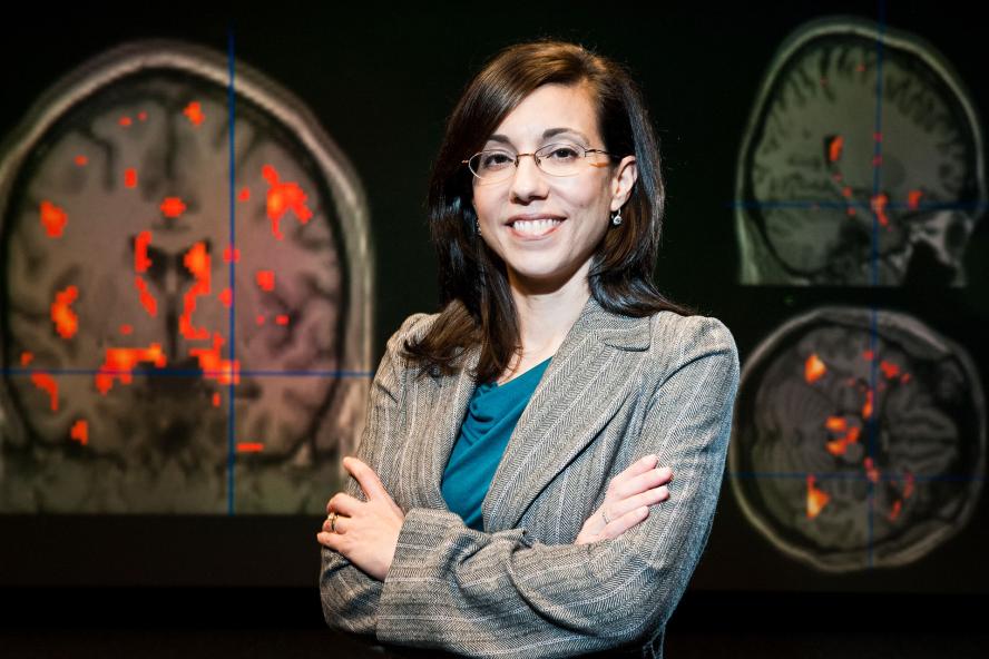 Professor Lisa Shin in front of her research