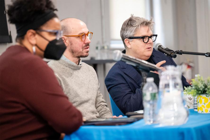 Prof. Huber, Prof. Hooley, and Prof. McNeil speaking at a panel lecture