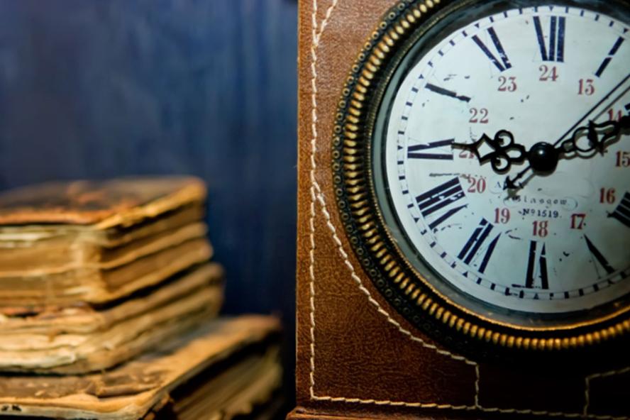 Antique clock with books