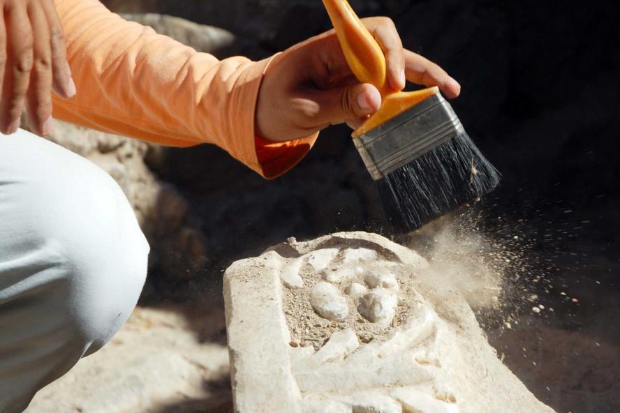 Person cleaning an architectural object