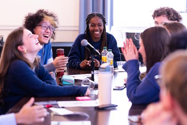 students laughing around a table