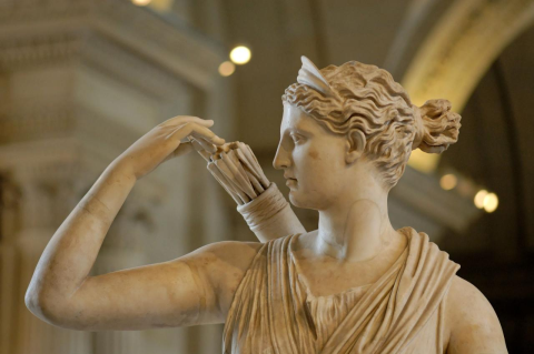 A marble statue of a woman reaching for arrows in a quiver on her back. The new NASA lunar program is named after Artemis, an ancient lunar goddess turned feminist icon