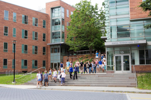 A campus tour at Tufts of students and parents walks by Sophia Gordon Hall in summer. Applications for the Tufts University undergraduate Class of 2027 top 34,000.