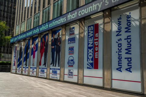 Fox News advertisements on the side of a building. Political scientist Jeffrey Berry weighs the odds that the TV network will alter the way it reports the news after paying a $787 million settlement to Dominion
