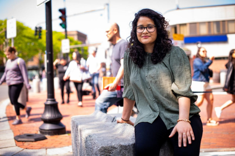 Sola Mahfouz in Davis Square, Somerville. She pursued an education against all odds in Afghanistan, starting with kindergarten math as a teenager—now she does research in quantum computing at Tufts