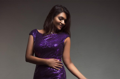 Tahanee Aluwihare in a purple gown.