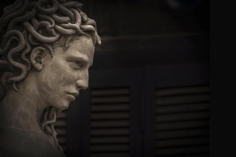 Detail of a modern statue of Medusa, showing her head in profile. Mythological figures like Demeter and Medusa illuminate women’s resistance and rebellion, says a Tufts classics professor
