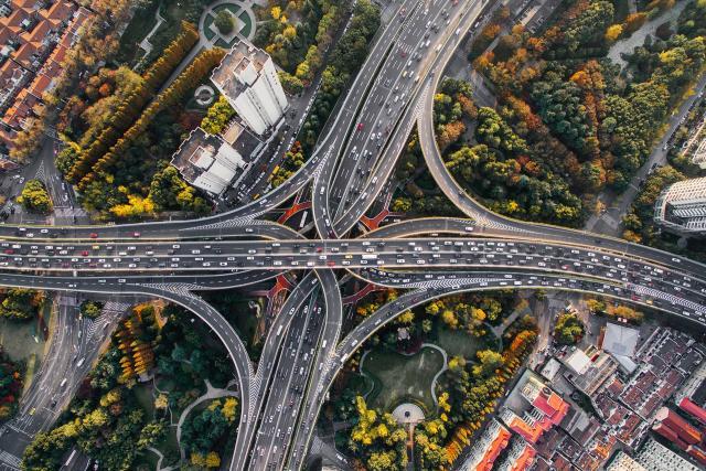 Aerial view of a cloverleaf highway interchange.