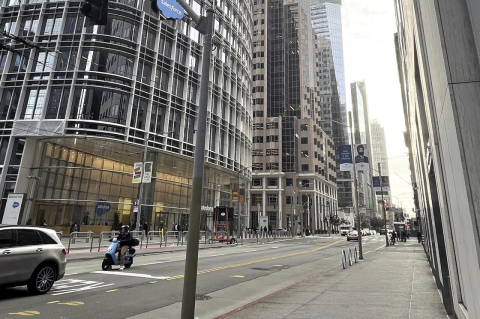 A mostly empty downtown street in San Francisco in the daytime. An urban planner argues that the urban doom loop downward spiral that some U.S. cities face is not inevitable, but requires active efforts to avoid